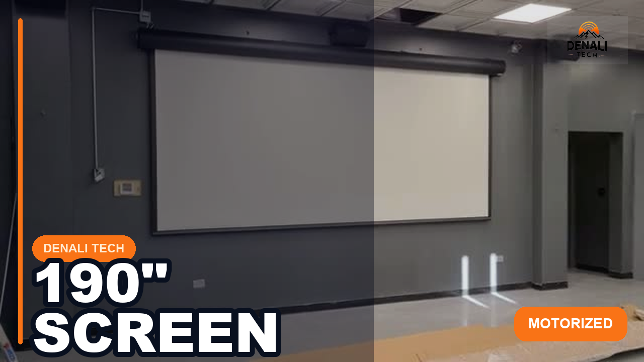 Large motorized projector screen installed in a home theater